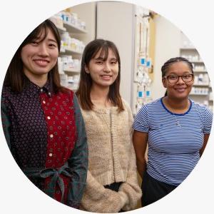 Students standing in mock pharmacy